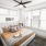 spacious bedroom with large, bright windows